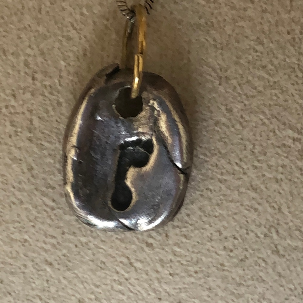 Little footprint pendant on silver chain